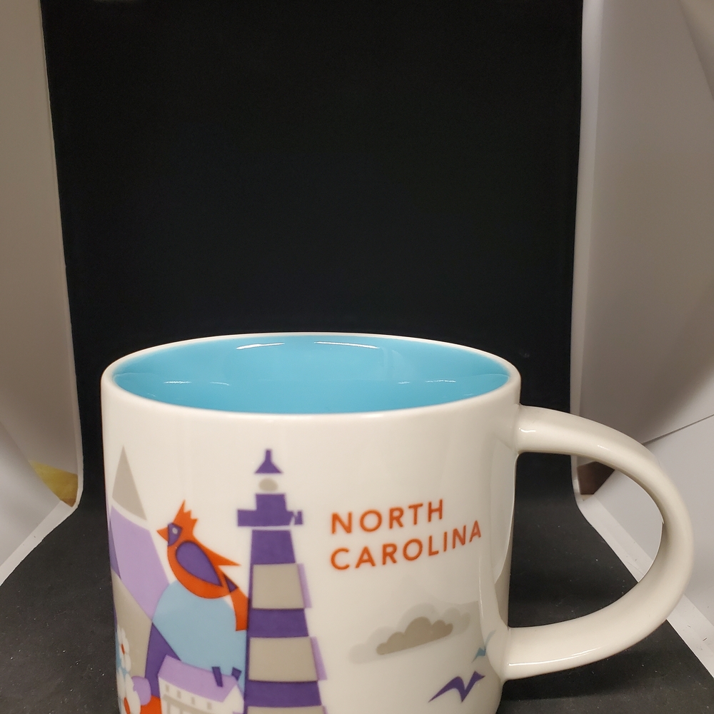 North Carolina Souvenir Mug with Blue Interior. No chips,cracks or stains.